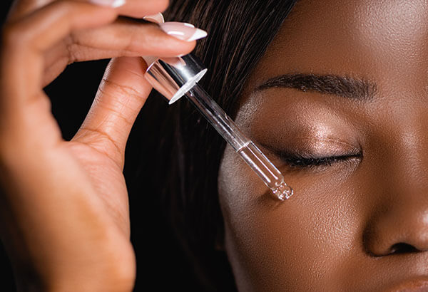woman applying squalane