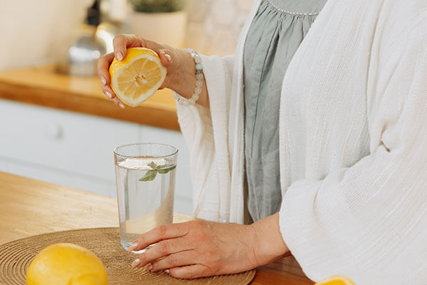 woman squeezing lemon