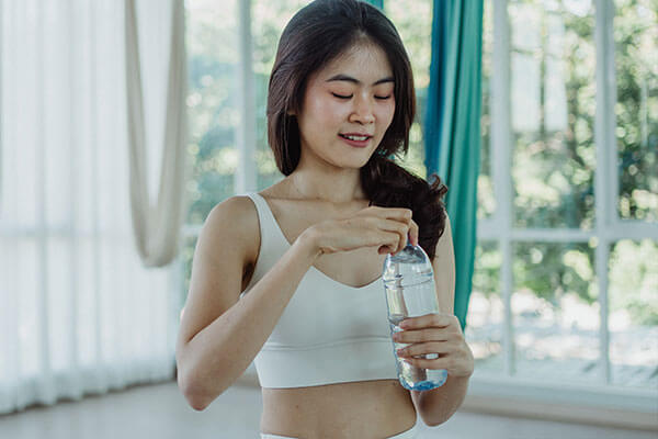 woman and water bottle