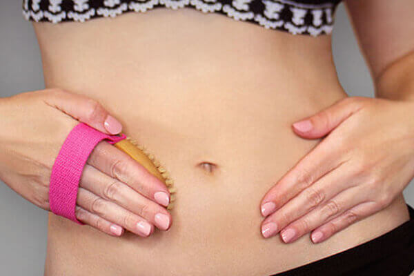 woman brushing tummy
